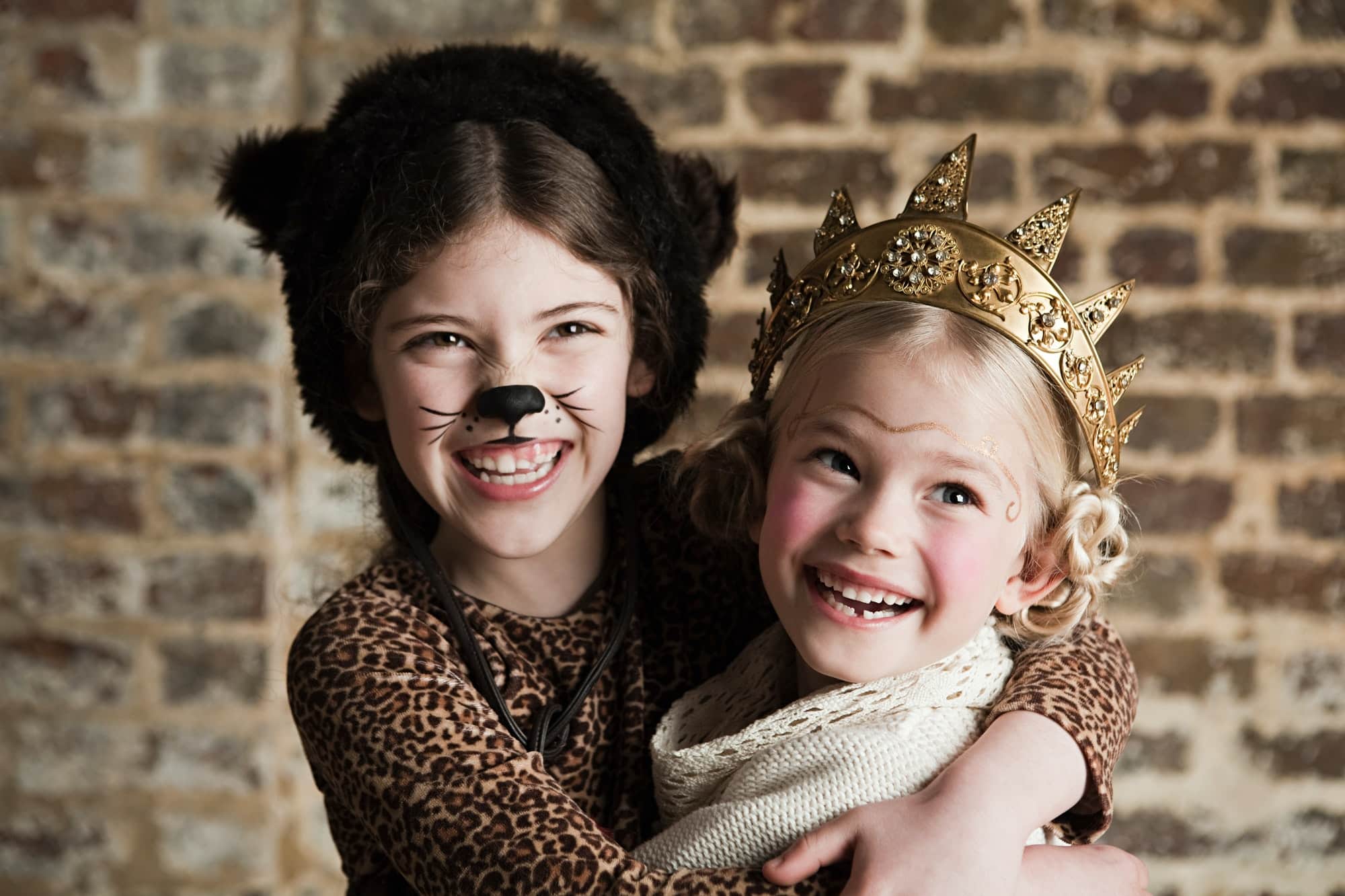 Young girls dressed up as cat and queen